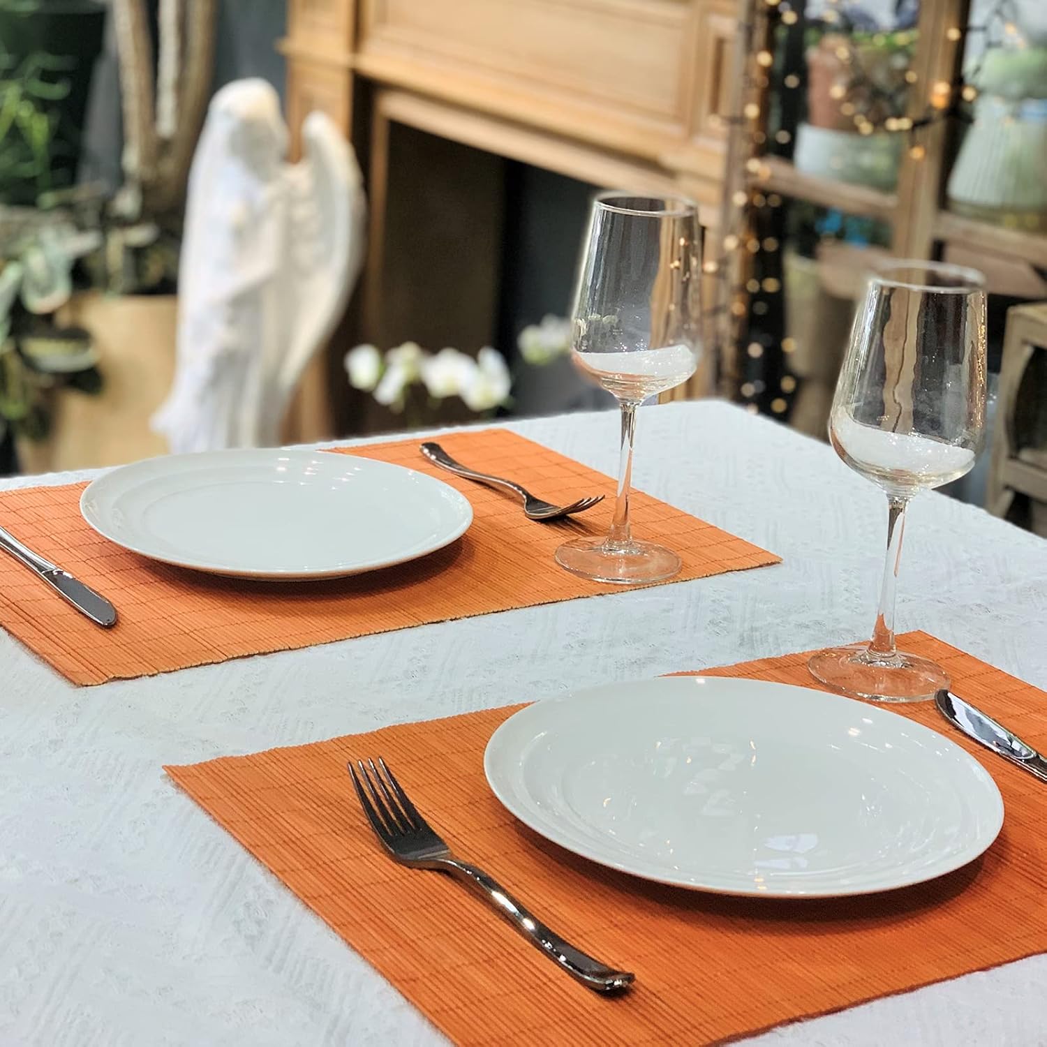 ANDSTAR Non-Slip Waterproof Placemats Set of 6 - Reusable Wipeable Table Mats for Dining Table, Kitchen, Outdoor Picnic, 12x18 Inch PVC Backed Heat Resistant Place Mats Dishwasher Safe（Orange）