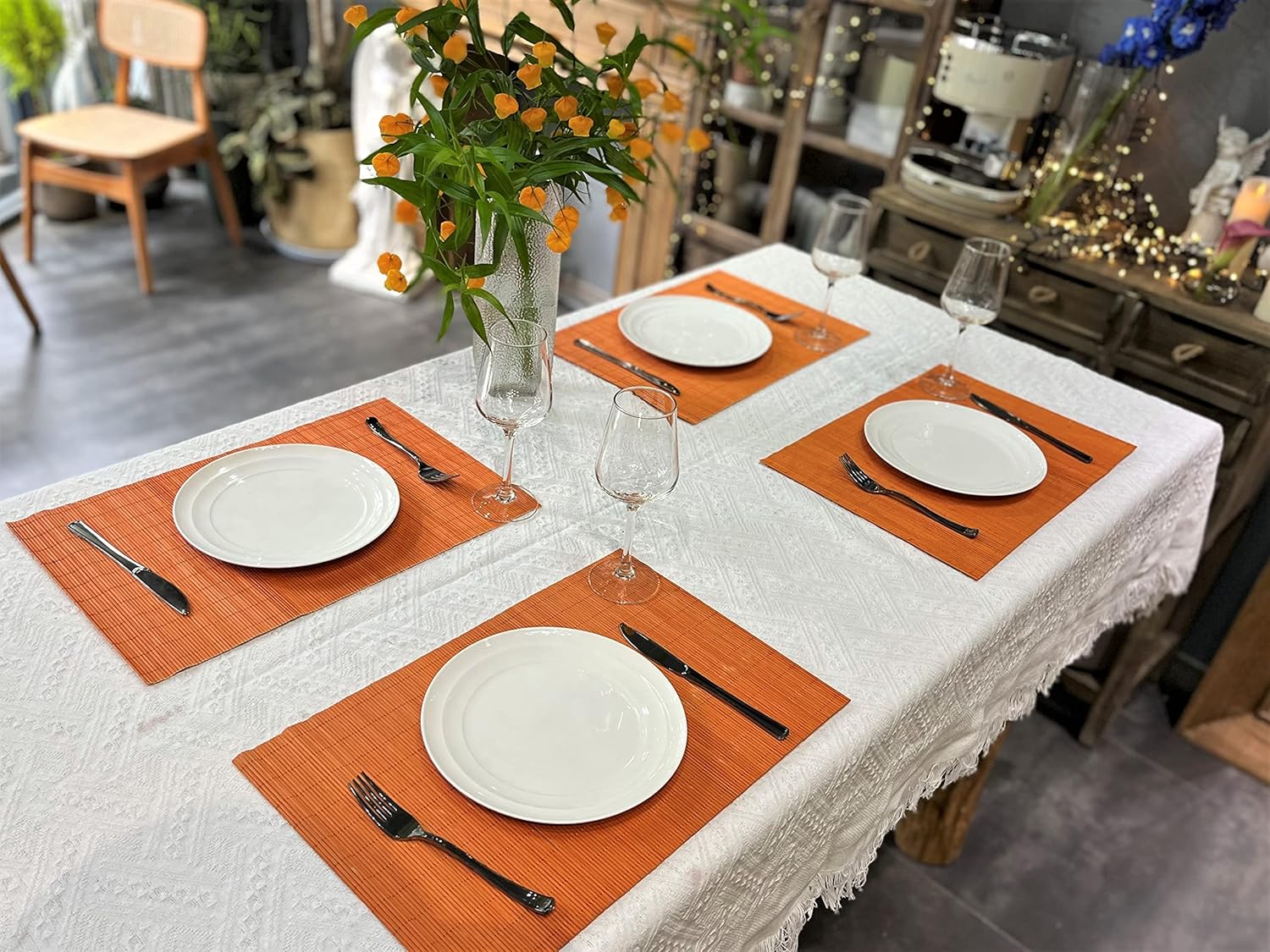 ANDSTAR Non-Slip Waterproof Placemats Set of 6 - Reusable Wipeable Table Mats for Dining Table, Kitchen, Outdoor Picnic, 12x18 Inch PVC Backed Heat Resistant Place Mats Dishwasher Safe（Orange）