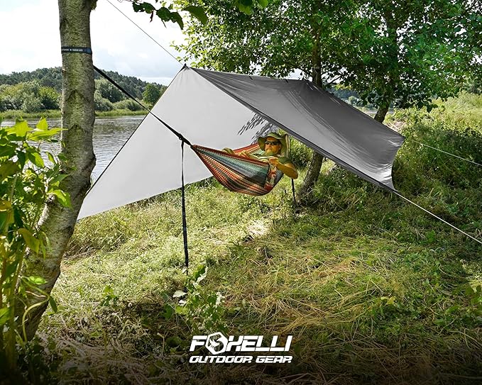 Foxelli Camping Tarp - 12x10ft Waterproof Rain Tarp, Lightweight Backpacking Rainfly Shelter with Included Extra Long Guy Lines & Stakes